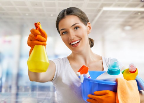 Cleaners maintaining a safe, tidy workplace through good housekeeping